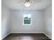 The bedroom features a modern ceiling fan and has hardwood floors with lots of natural light at 109 Downing St, Troutman, NC 28166