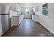 Bright kitchen featuring white cabinets, stainless steel appliances, and wood floors at 109 Downing St, Troutman, NC 28166