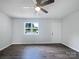 Spacious living area with hardwood floors and ample natural light from the window at 109 Downing St, Troutman, NC 28166