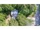 Aerial view of a home surrounded by lush greenery, trees, and a well-maintained yard at 114 Walnut Creek Rd # 24, Belmont, NC 28012