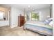 Bedroom featuring a four-poster bed, carpet and a window with backyard views at 114 Walnut Creek Rd # 24, Belmont, NC 28012