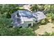 Aerial view highlighting the home's architecture, roof, and its location surrounded by trees at 114 Walnut Creek Rd # 24, Belmont, NC 28012