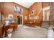 Living room with wood paneling, carpet floors, and a staircase leading to the upper floor at 114 Walnut Creek Rd # 24, Belmont, NC 28012