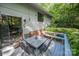 Outdoor seating area features a table, chairs, and nearby landscaping at 114 Walnut Creek Rd # 24, Belmont, NC 28012