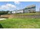 Backyard of gray houses with a green lawn, offering outdoor space in a neighborhood setting at 119 Longwood Rd # 62, Mooresville, NC 28115