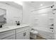 Bathroom featuring a single sink vanity, toilet, shower and bathtub, with neutral earth tone decor at 119 Longwood Rd # 62, Mooresville, NC 28115