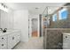 Well-lit bathroom featuring double sinks, a large shower, and tile flooring at 119 Longwood Rd # 62, Mooresville, NC 28115