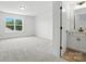Spacious bedroom features a large window letting in natural light and access to a private bathroom at 119 Longwood Rd # 62, Mooresville, NC 28115