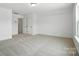 Bright, carpeted bedroom with neutral walls, ample space, and closet doors provides a calm retreat at 119 Longwood Rd # 62, Mooresville, NC 28115