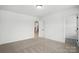 Spacious bedroom with an ensuite bathroom entrance and a view of the staircase at 119 Longwood Rd # 62, Mooresville, NC 28115