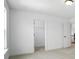 Large bedroom showcasing an entrance to a walk-in closet and an ensuite bathroom at 119 Longwood Rd # 62, Mooresville, NC 28115