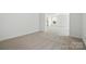 Bright bonus room with neutral carpet at 119 Longwood Rd # 62, Mooresville, NC 28115