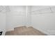 Walk-in closet with wall-mounted wire shelving providing ample storage space at 119 Longwood Rd # 62, Mooresville, NC 28115
