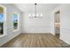 Formal dining room featuring large windows, wainscoting, and modern light fixture at 119 Longwood Rd # 62, Mooresville, NC 28115
