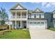 Charming two-story home with a welcoming front porch and attached two-car garage at 119 Longwood Rd # 62, Mooresville, NC 28115