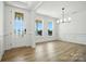 Bright foyer with decorative glass door, wood floors, and natural light at 119 Longwood Rd # 62, Mooresville, NC 28115