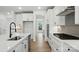 Bright kitchen featuring an island, stainless appliances, and hardwood floors at 119 Longwood Rd # 62, Mooresville, NC 28115