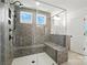 Modern shower with gray hexagon tiles, a glass door, and a built-in bench at 119 Longwood Rd # 62, Mooresville, NC 28115