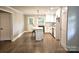 Eat-in kitchen includes an island with seating, stainless steel appliances, and hardwood floors at 13131 601 S Hwy, Midland, NC 28107