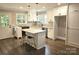 Well-lit kitchen featuring a center island, stainless appliances, countertops, and modern finishes at 13131 601 S Hwy, Midland, NC 28107