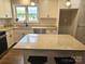 Modern kitchen with stainless appliances, stone countertops, breakfast bar, and modern lighting at 13131 601 S Hwy, Midland, NC 28107