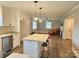 Bright kitchen boasts an island, granite countertops, stainless steel appliances, and modern cabinetry at 13131 601 S Hwy, Midland, NC 28107