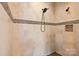 The bathroom includes a shower with a tile surround and a mosaic accent at 15909 Heath Aster Way, Davidson, NC 28036