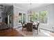 Light-filled dining room featuring hardwood floors and backyard view at 15909 Heath Aster Way, Davidson, NC 28036