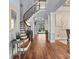 Grand foyer with hardwood floors, a curved staircase, and elegant architectural details at 15909 Heath Aster Way, Davidson, NC 28036