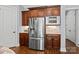 Bright gourmet kitchen with stainless appliances, granite counters, hardwood floors and custom backsplash at 15909 Heath Aster Way, Davidson, NC 28036