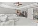 This large living room has a sectional sofa, and a gaming room with some arcade machines at 15909 Heath Aster Way, Davidson, NC 28036