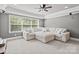 A large white sectional sofa with a window in a living room at 15909 Heath Aster Way, Davidson, NC 28036