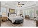 This main bedroom has wood floors, white trim and paint and lots of natural light at 15909 Heath Aster Way, Davidson, NC 28036