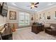 This home office has a large desk, guitars hanging on the wall and a large window at 15909 Heath Aster Way, Davidson, NC 28036
