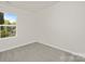 Bright bedroom with plush carpeting, natural light, and neutral wall color at 1841 Bear St, Charlotte, NC 28213