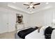 Relaxing bedroom showcasing tray ceilings, neutral decor, and two entry doors at 1841 Bear St, Charlotte, NC 28213