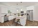 Modern kitchen with granite counters, stainless steel appliances, and a center island with stools at 1841 Bear St, Charlotte, NC 28213