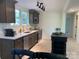 Updated kitchen features stainless appliances, modern countertops, and dark wood cabinets at 188 Bailey Rd, Mooresville, NC 28117