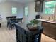 Bright kitchen with a stylish island that connects to the dining area at 188 Bailey Rd, Mooresville, NC 28117