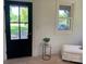 Bright living area with black front door, a side table, and a view to the outside at 188 Bailey Rd, Mooresville, NC 28117
