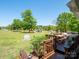 Expansive backyard features a wooden deck with outdoor seating and views of the playground and green space at 2008 Faulkner Rd, Clover, SC 29710