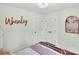 Bright bedroom features white walls, hardwood floors, and a double closet at 2008 Faulkner Rd, Clover, SC 29710