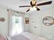 Bright bedroom featuring hardwood floors, white walls, and sheer curtains at 2008 Faulkner Rd, Clover, SC 29710