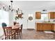 Bright dining area with tile flooring, a wooden table set, and a view of the yard at 2008 Faulkner Rd, Clover, SC 29710