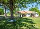 Expansive, well-maintained front yard features a large shade tree and covered parking at 2008 Faulkner Rd, Clover, SC 29710