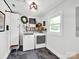 Functional laundry room with modern washer and dryer, storage cabinets, and natural light at 2008 Faulkner Rd, Clover, SC 29710