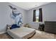 Whimsical bedroom with unique wall art and lots of natural light at 2119 Smith Rd, Clover, SC 29710