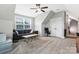 Upstairs bonus room with comfortable seating, a ceiling fan, and lots of natural light at 2119 Smith Rd, Clover, SC 29710