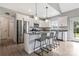 Modern kitchen with stainless steel appliances, granite countertops, and breakfast bar seating, designed for culinary enthusiasts at 2119 Smith Rd, Clover, SC 29710