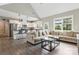 Open living area with a modern kitchen, comfortable seating, and large windows, creating a bright and airy atmosphere at 2119 Smith Rd, Clover, SC 29710